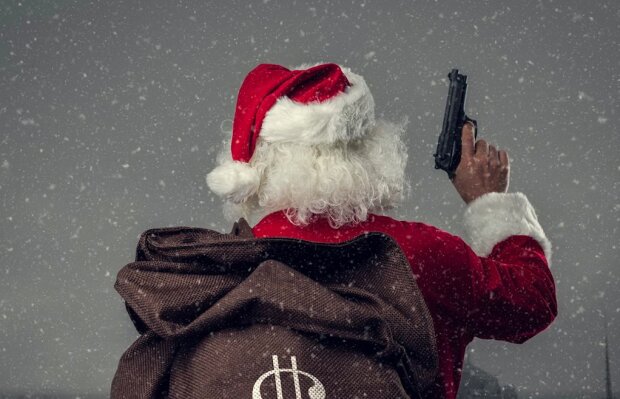 Bankovní lupič podobný Santa Clausovi rozházel právě ukradené peníze uprostřed ulici křiče "Veselé Vánoce!"